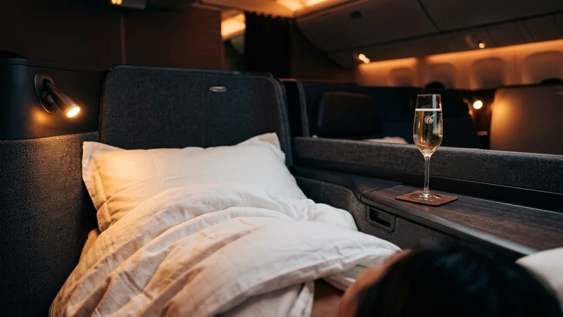 Business class lie-flat seat with bedding