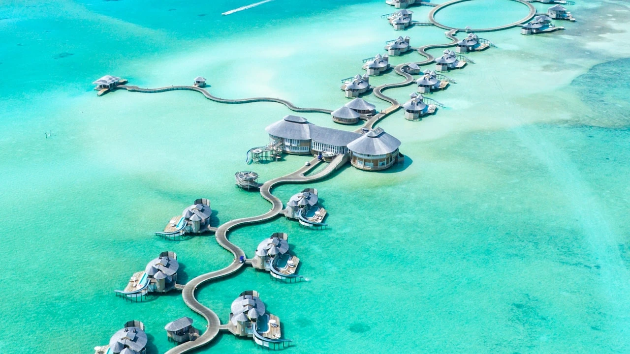 Luxury overwater bungalows and turquoise lagoon in the Maldives
