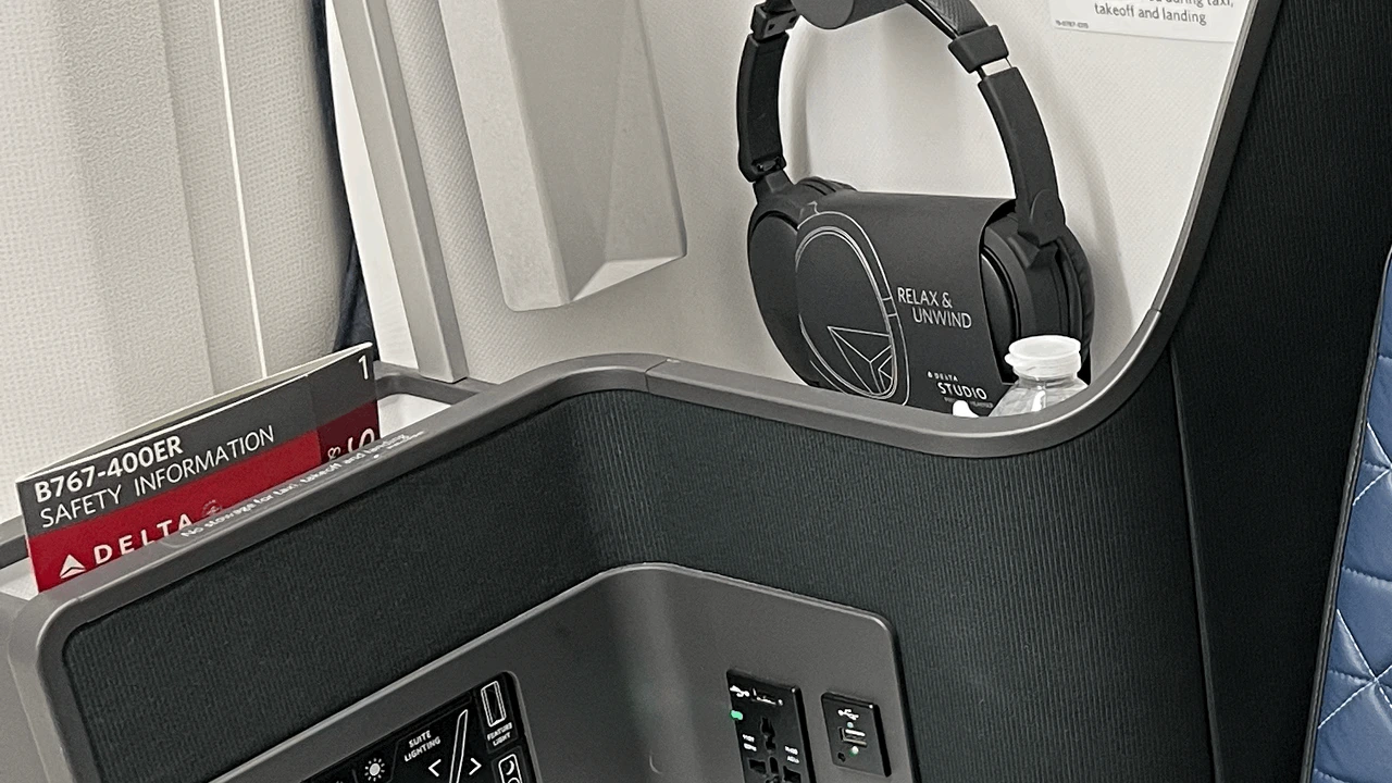Delta One Suite seat console and headphone connectivity