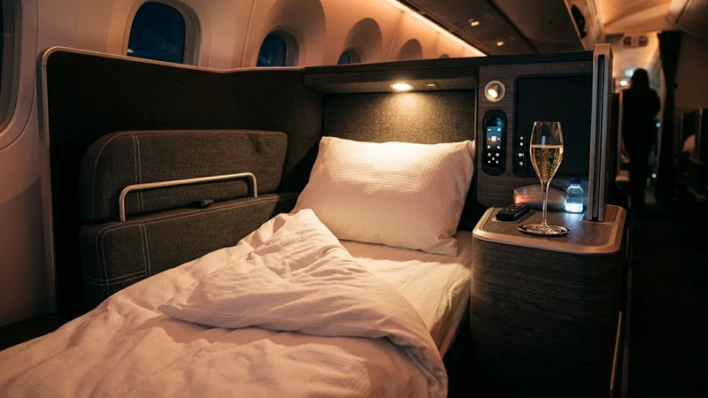 Business class lie-flat seat with bedding